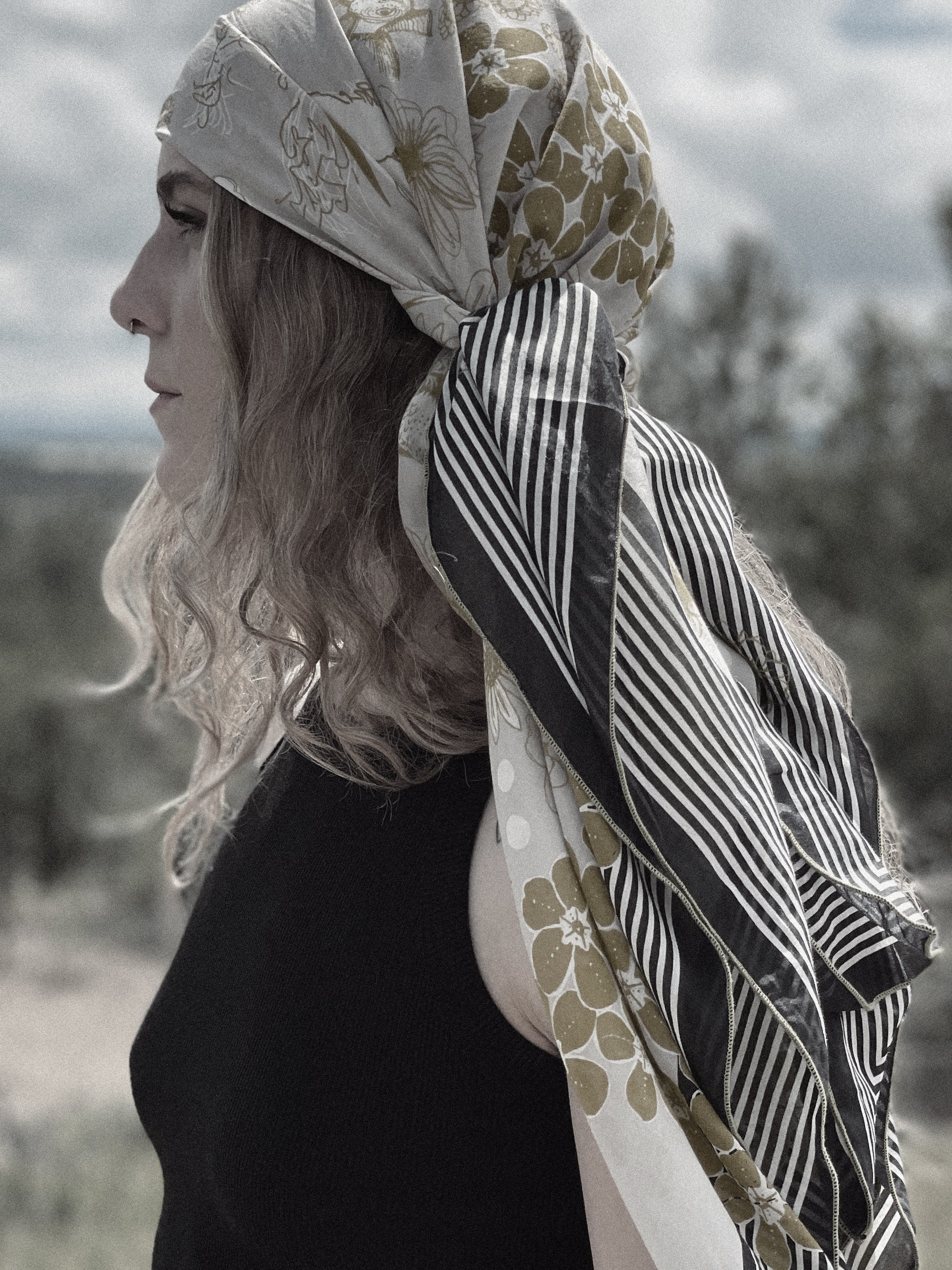 boho style done right in our silk cotton oversized wrap. Wear as a head scarf, a sarong, or a scarf top. Our Jardin d'Or scarf features a delightful illustrated fantasy garden in ochre and taupe with bold black and white striped border