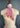 A vintage "My Favorite Bandana in Pink 66" scarf, tied stylishly and showcased beautifully. It's from the brand At Home With Ray.