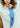 Ray pure silk ribbon scarf Lake Days butter yellow tied in a bow around her neck — lake toile design with French blue pinstripe reverse by Ray