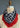 The Corn Dancer in Jet from At Home With Ray is artfully draped, tied with a southwestern twist. The scarf, which displays frayed edges, features a monochrome houndstooth pattern on one end that contrasts elegantly with its solid red color.