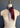 A display showcases "The Snowy Mustang" scarf by At Home With Ray, elegantly wrapped around a neck. The luxurious cashmere silk blend features a striking dual-color design: one side in deep burgundy and the other in light gray.